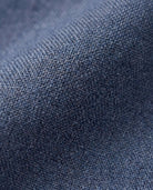 Texture of Indigo Chambray Stretchy Mod Suit Pants showcasing soft fabric and lightweight weave.