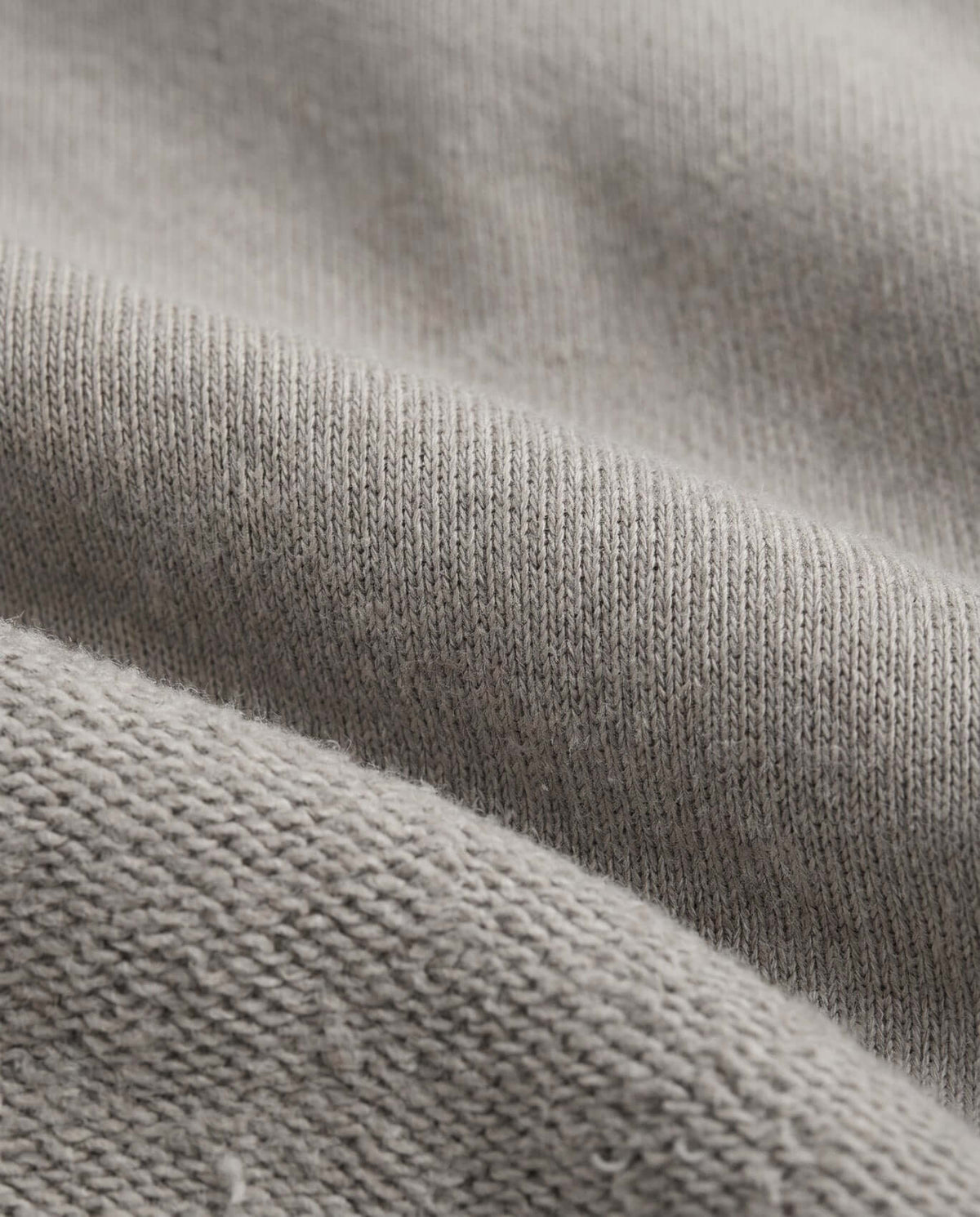 Cement Strivers Hoodie fabric detail showcasing soft fleece texture in neutral cement grey, ideal for active kids.