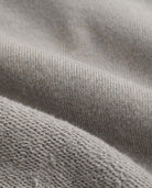 Cement Strivers Hoodie fabric detail showcasing soft fleece texture in neutral cement grey, ideal for active kids.