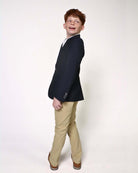 Child modeling an Indigo Suit Blazer with khaki pants, showcasing a stylish and polished look.