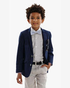 Boy wearing an Indigo Suit Blazer, paired with a button-down shirt and bow tie, showcasing a polished look.