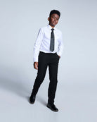 Boy in white shirt and black tie wearing Black Suit Pants, showcasing a stylish formal look.