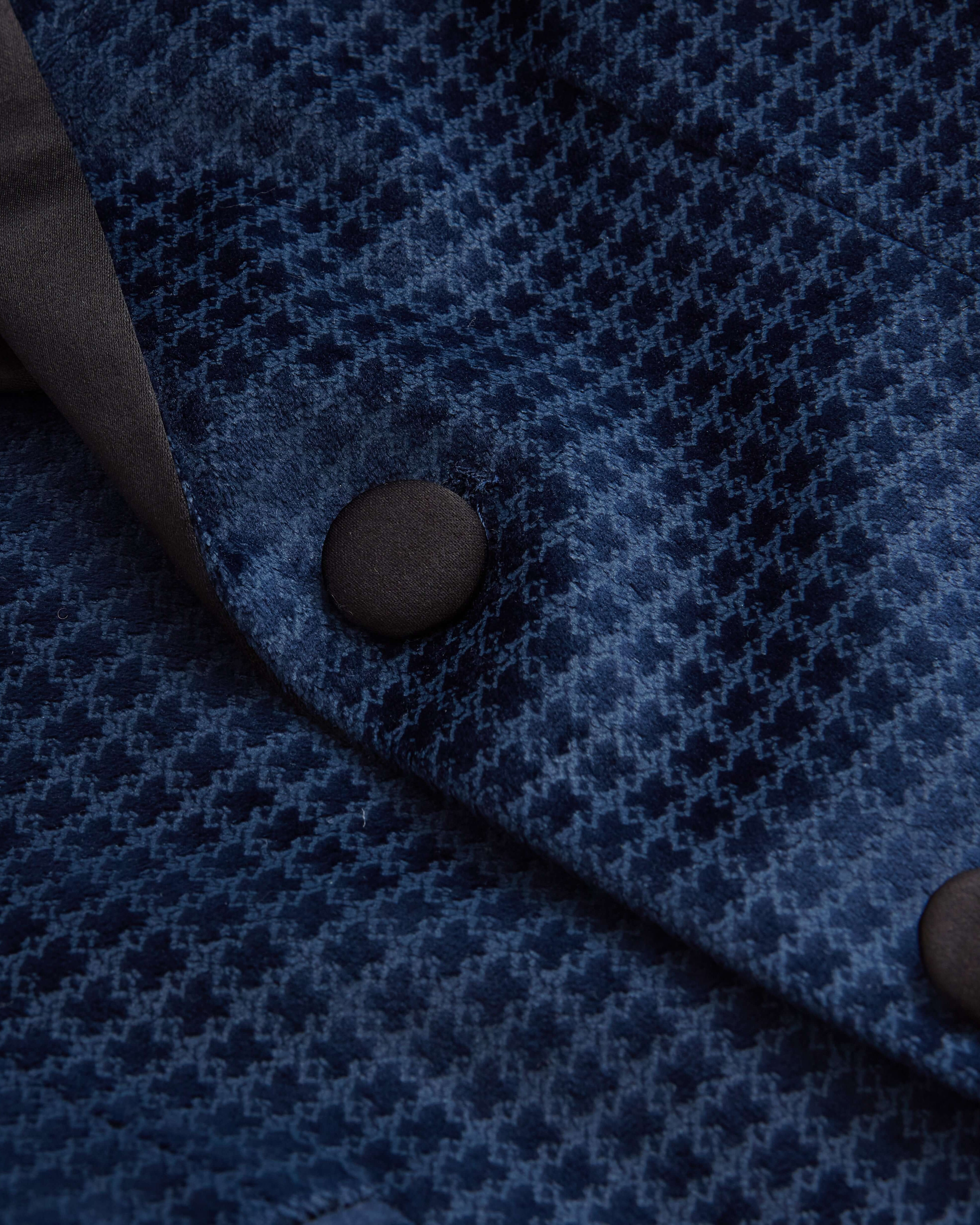 Close-up of the Navy Geo Velvet Tuxedo Jacket showing rich velvet fabric and elegant buttons.