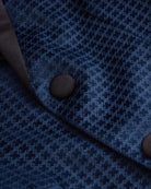 Close-up of the Navy Geo Velvet Tuxedo Jacket showing rich velvet fabric and elegant buttons.