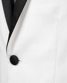 Close-up of White Tuxedo Suit Jacket featuring satin lapels and button-front closure.