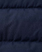 Close-up of the fabric texture of the Dark Navy Packable Vest, showcasing its lightweight and durable material.