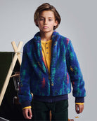 Young boy modeling the Wilderness Fleece Sweat Set zip-front jacket in vibrant colors.