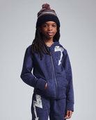 Kid wearing Navy Blue Wind Hat with pom pom, styled in a cozy outfit, perfect for outdoor adventures.