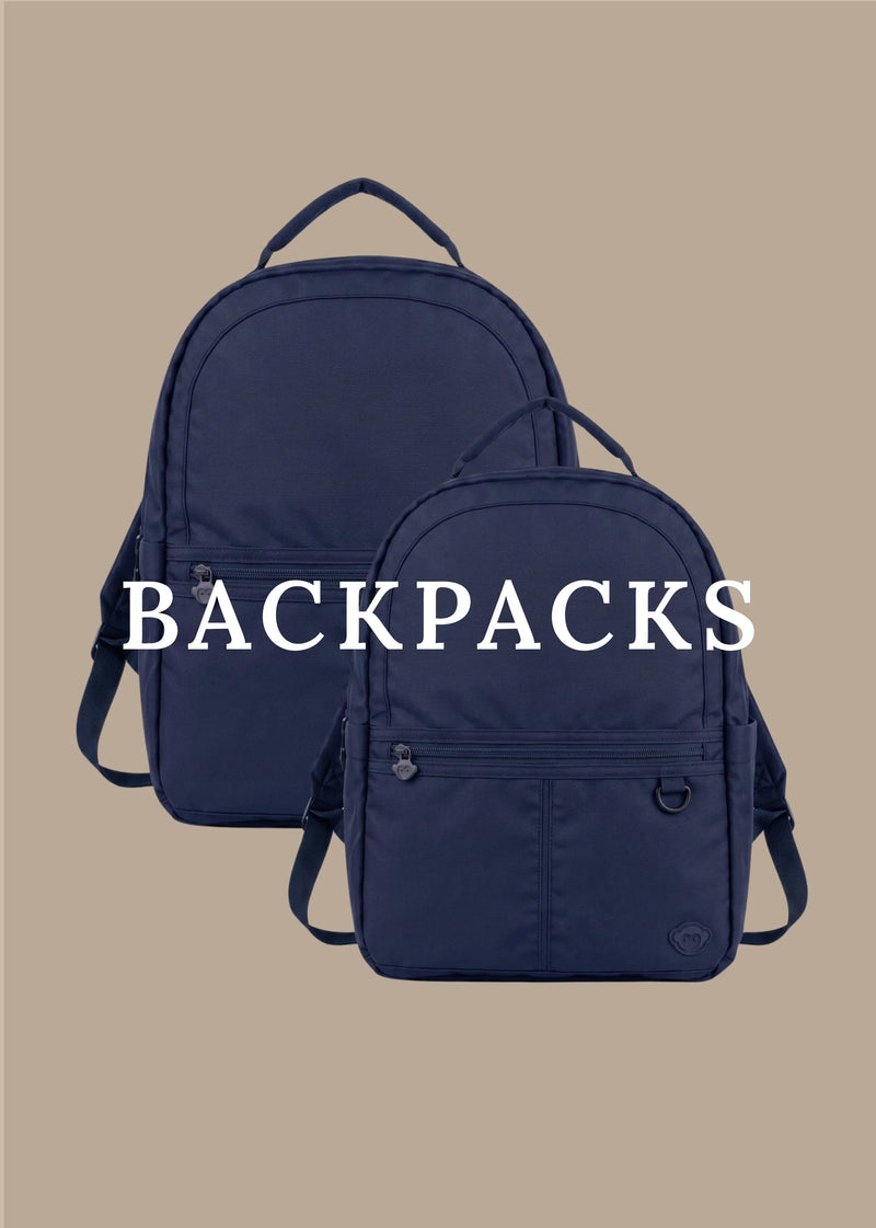 Two navy blue backpacks shown against a solid beige background, with the word 'BACKPACKS' overlaid in large white text across the center.