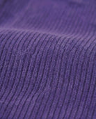 Close-up of the textured fabric of the Hyacinth Barbour Cord Jacket in rich purple corduroy.