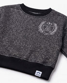 Black Glitter City Sweatshirt featuring a sparkly black glitter print and ribbed cuffs for girls.