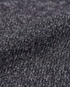 Close-up of the fabric texture showcasing the shimmer in the Black Glitter City Sweatshirt.