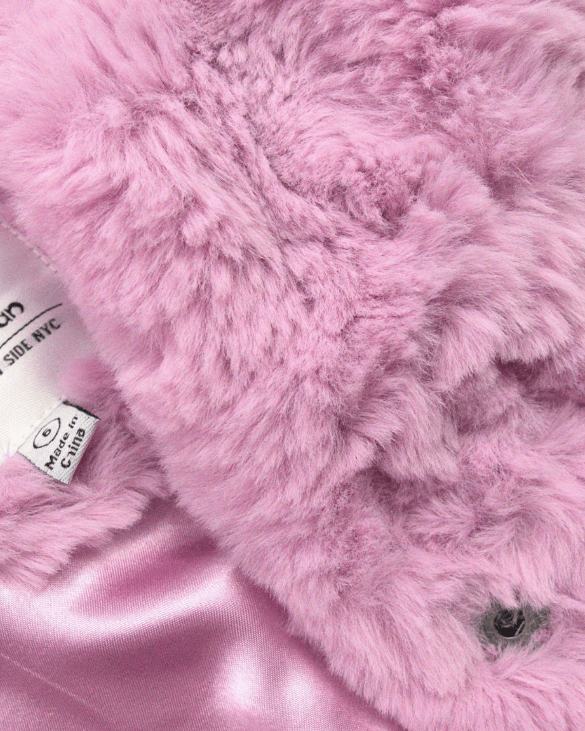 Pink Mousse Cleo Faux Fur Coat featuring ultra-soft pink faux fur and satin lining.
