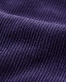Close-up of textured corduroy fabric in deep purple for Hyacinth Girls Club Pants.