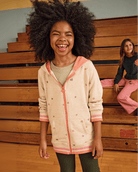 Heart Pink Sweat Set featuring a joyful girl wearing a soft hoodie, perfect for comfortable layering and playful wear.
