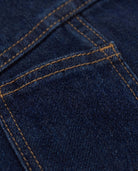 Close-up of the fabric and stitching detail of the Moonlight Wash Jojo Denim Jumpsuit.
