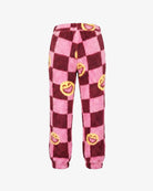 Pink and dark red checkered fleece pants with yellow smiley face prints, shown against a plain white background.