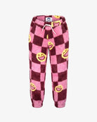 Pink and dark red checkered fleece pants with yellow smiley face prints and a white drawstring, shown against a plain white background.