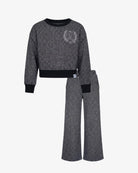 A two-piece kids' lounge set consisting of a cropped long-sleeve sweatshirt and matching wide-leg pants in a heathered dark gray fabric, with solid black ribbed trim at the crew neck, cuffs, and hem. The sweatshirt features a small silver-toned embroidered crest on the left chest.
