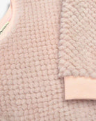 Vintage Pink Laurel Top featuring cozy faux fur and diamond quilted pattern for warmth.