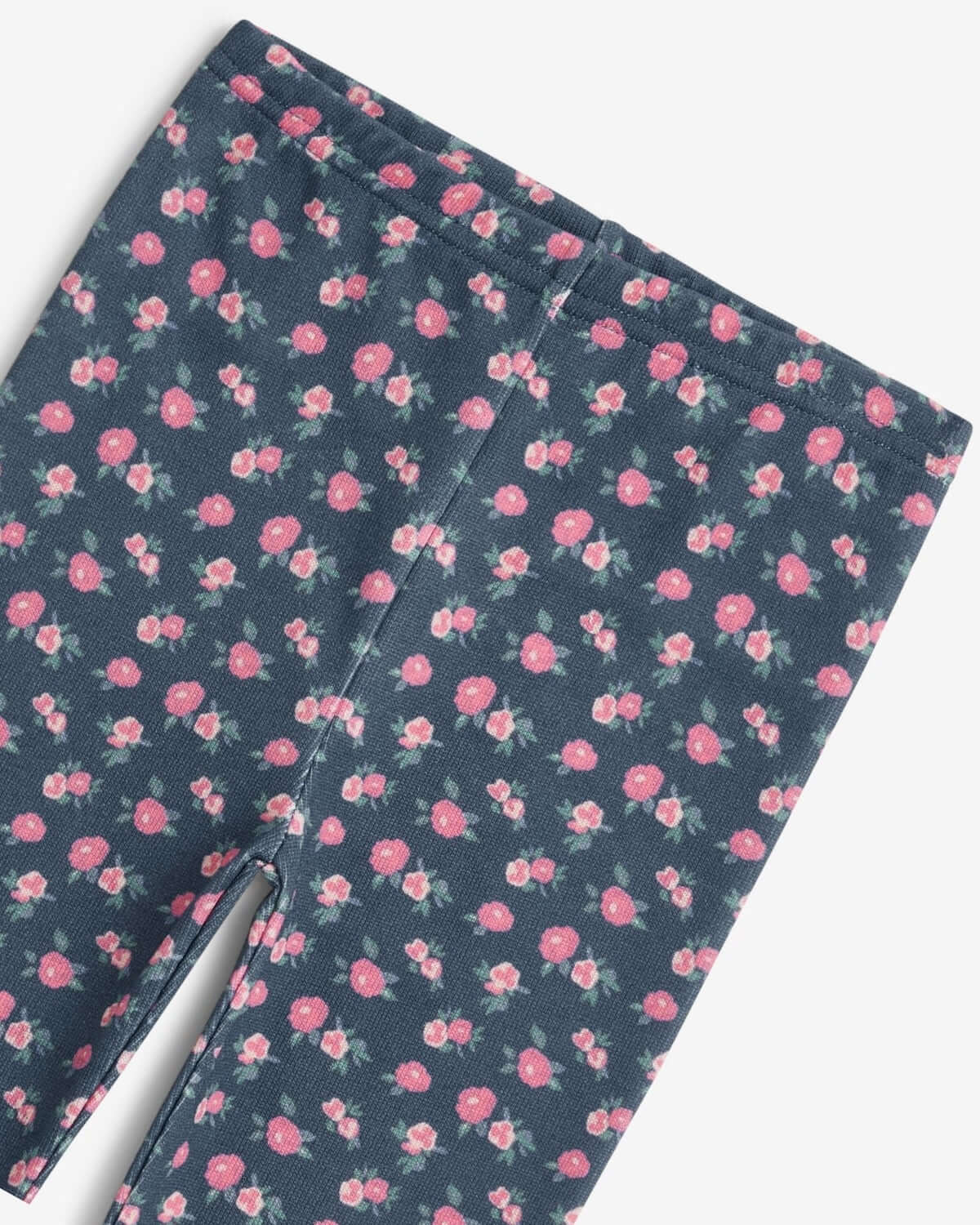 Navy Primrose Leggings featuring a playful pink rose print on a rich navy base.