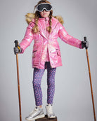 Navy Primrose Leggings worn under a pink ski jacket, perfect for kids' stylish and cozy winter wear.