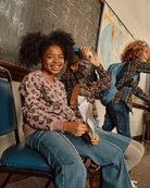 Kids wearing the Leopard Ruby Sweatshirt in a classroom, showcasing trendy leopard print and happy expressions.