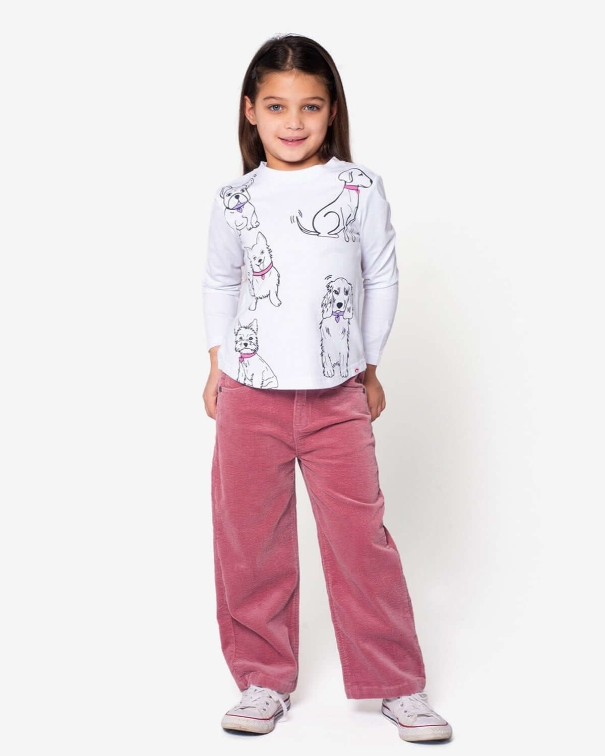 Girl wearing Dusty Rose Liana Jeans with a cute dog graphic shirt.