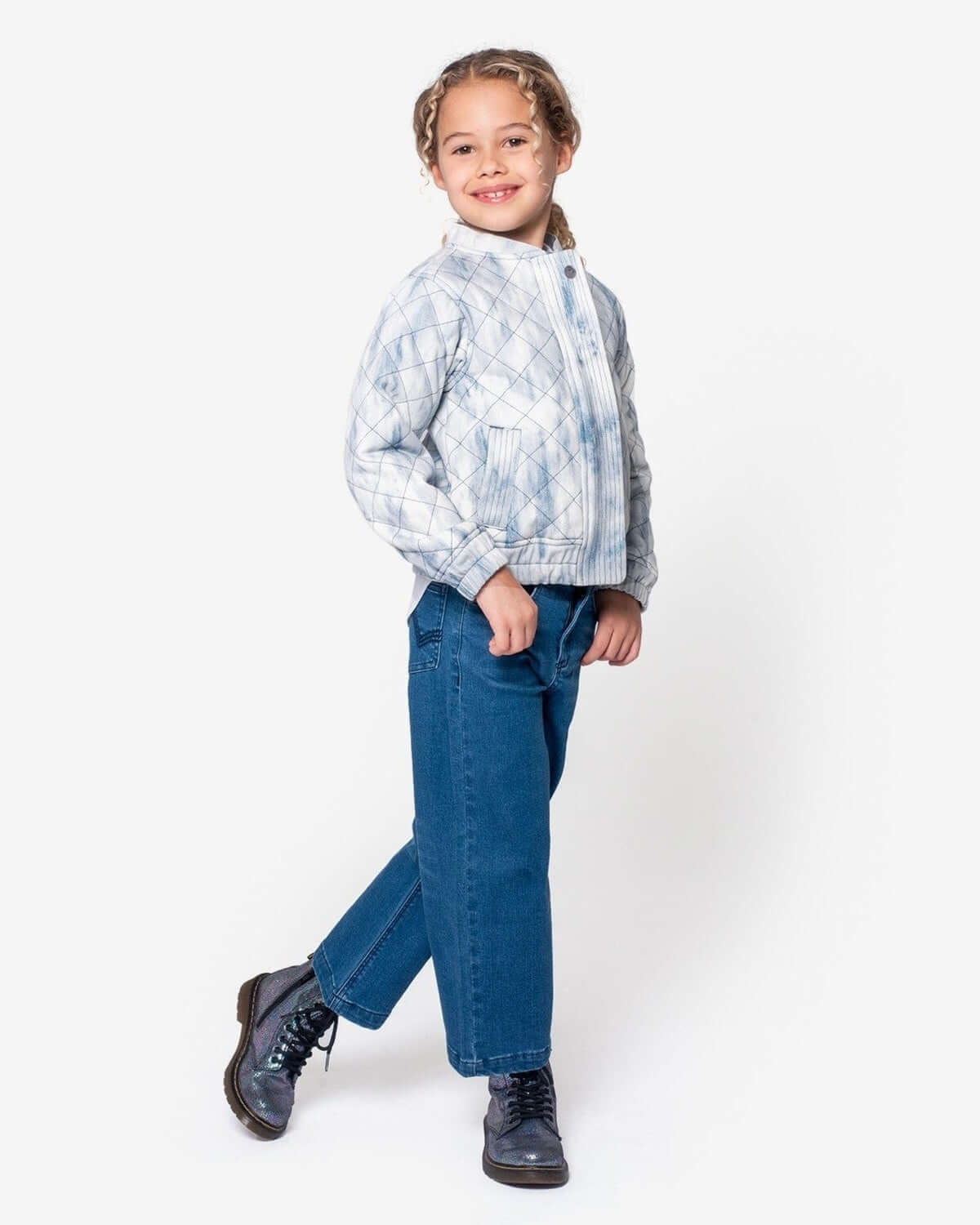 Girl wearing Medium Wash Liana Pant and stylish jacket, showcasing a trendy look for kids.