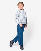 Girl wearing Medium Wash Liana Pant and stylish jacket, showcasing a trendy look for kids.