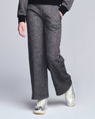 Black Glitter Lily Seamed Sweatpants showcase a stylish look with comfortable, chic design for active kids.