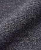 Close-up of Black Glitter Lily Seamed Sweatpants fabric showcasing soft texture and glitter finish, perfect for active kids.