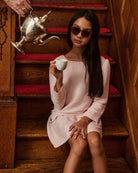 A girl wearing a pink dress and sunglasses. Appaman Fall/Winter 2026 collection.