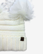 Winter White Mia Pom-Pom Beanie with faux fur pom poms and cream ribbed knitting for stylish warmth.