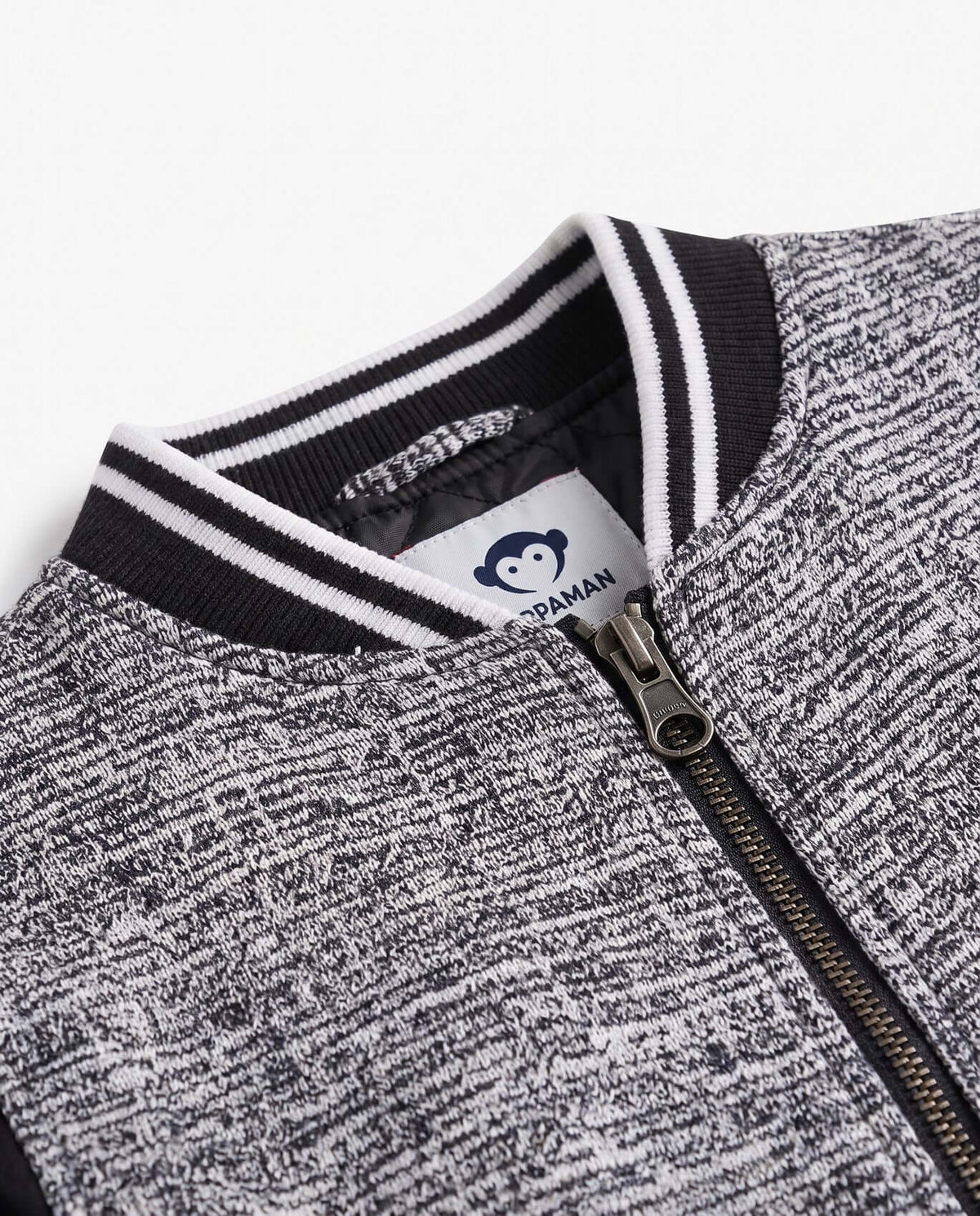 Black Boucle Nikki Bomber Jacket close-up showing luxe texture and zipper details.