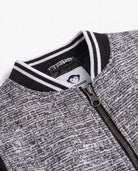 Black Boucle Nikki Bomber Jacket close-up showing luxe texture and zipper details.