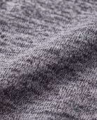Texture detail of the fabric featured in the Black Boucle Nikki Bomber Jacket, showcasing quality and style.