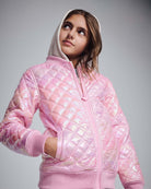 Pink Shine Bomber Jacket on a girl with shiny pink quilted exterior and oatmeal hood.