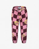 Girls Pink Smiles Fleece Set featuring cozy pink fleece pants with smiley face pattern