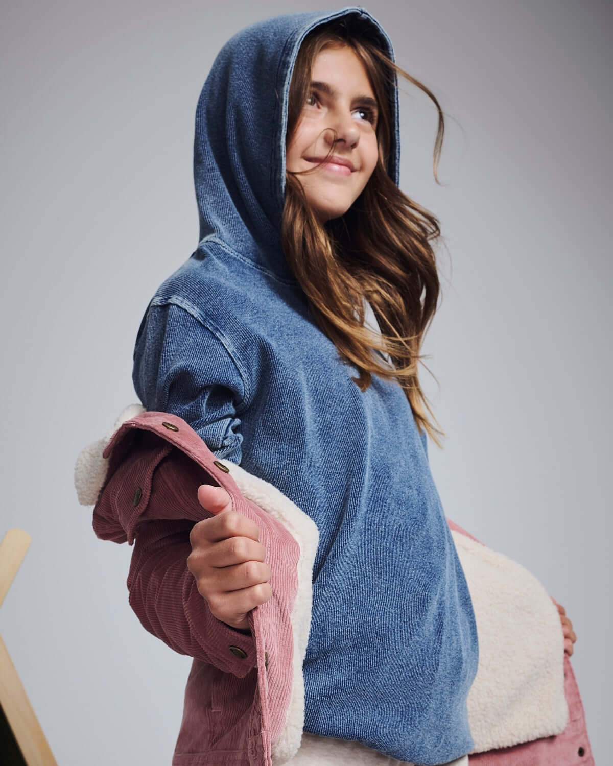 Dusk Blue Pullover Hoodie worn by a girl, featuring a casual look with a stylish vibe.