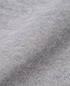 Close-up of soft heather grey fabric for the Heather Grey Ruffle Tee, showcasing its texture and comfort.