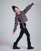 Active child in stylish Black Shine Leggings and a plaid crop jacket, showcasing comfort and style.