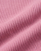 Close-up of the soft ribbed fabric in Dusty Pink Vanna Half Zip Sweater, showcasing texture and color.