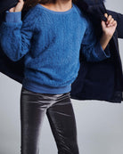 Dusty Blue Willow Top worn by a child, showcasing cozy, fuzzy fabric and relaxed fit, perfect for warm comfort.