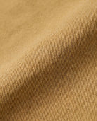 Close-up view of camel twill fabric used in the Camel Twill Yara Cargo Skirt, displaying texture and color.