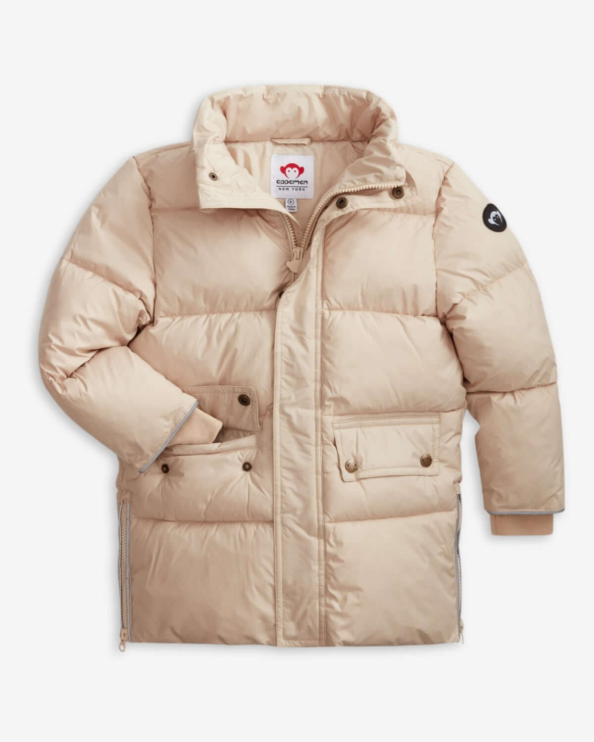 Ivory Expedition Puffer Coat displayed in beige color with buttons and pockets, featuring a warm puffer design.