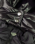 Close-up of Black Park Ave Long Puffer showing its soft insulated lining and stylish buttons.