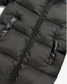 Black Park Ave Long Puffer jacket detail, showcasing sleek black fabric and puffy insulation.