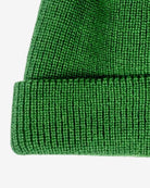 Cozy hunter green knit beanie with a turn-up cuff for kids—stylish warmth for winter adventures!