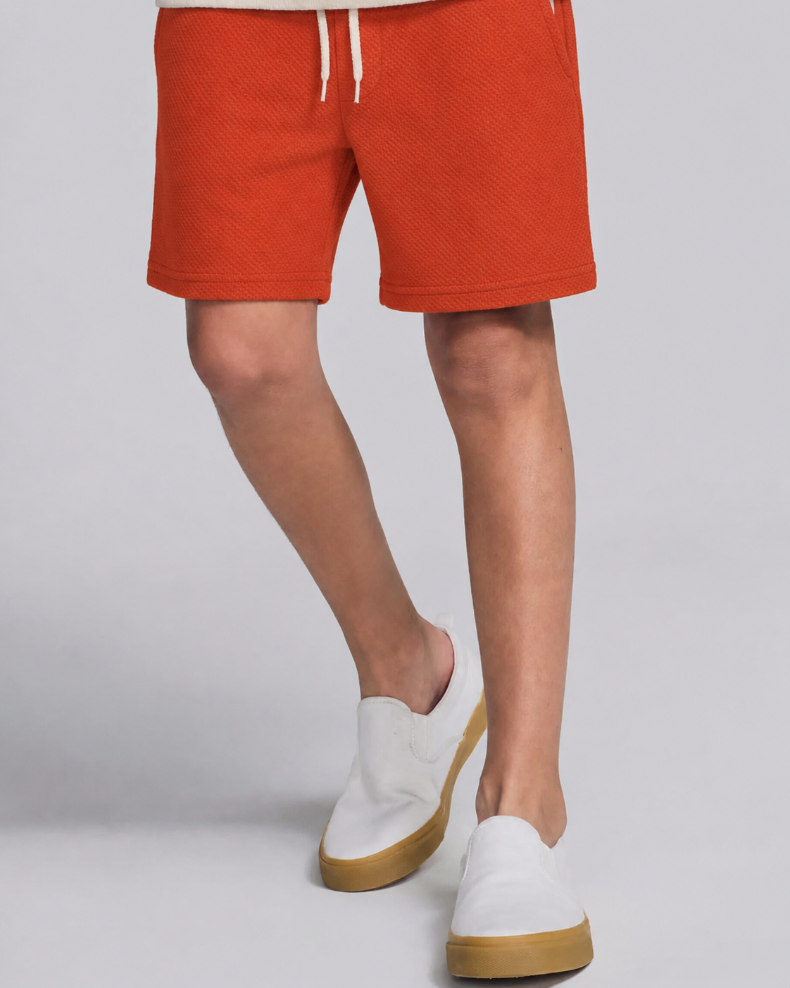 boy in red clay shorts